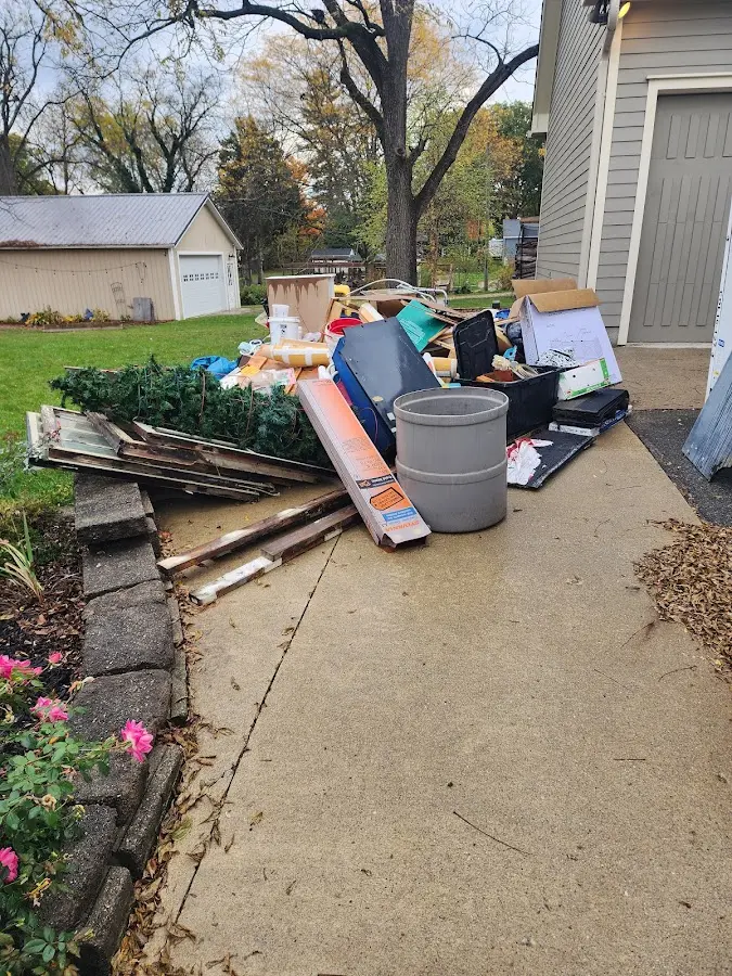 Dumpster being loaded with debris for Residential Dumpster Rental in Hazel Green